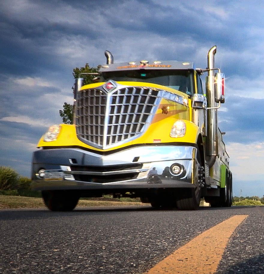 two yellow trucks front view