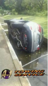 Towing Services 18103 of Jeep lying in water Fish Hatchery
