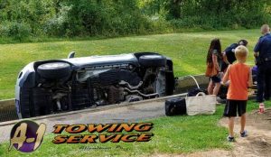 With People looking Towing-Services 18103 of Jeep lying in water Fish Hatchery